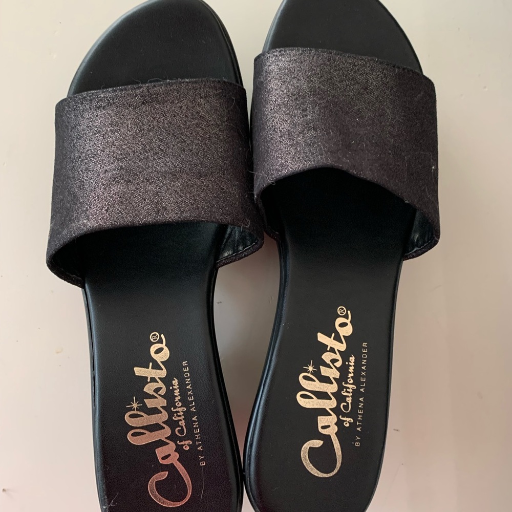 Very pretty sandal. Dark shimmery brown/ black. Worn once. Excellent condition.